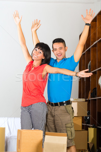 Stock photo: Asian couple moving in the new home