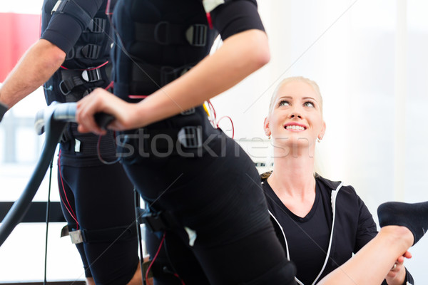 Man and woman having ems training Stock photo © Kzenon