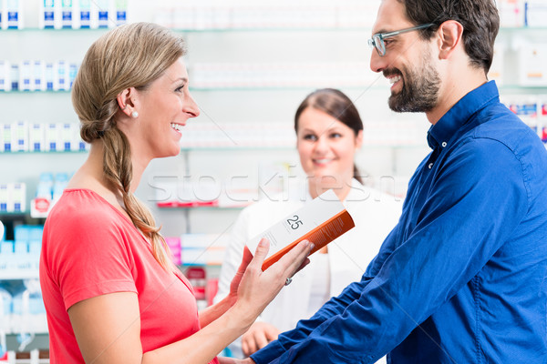 Woman and man buying drugs in pharmacy Stock photo © Kzenon
