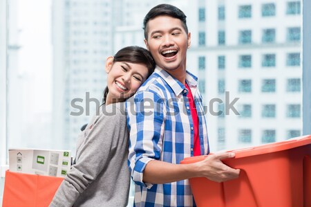 Asian couple after relocation to new apartment  Stock photo © Kzenon