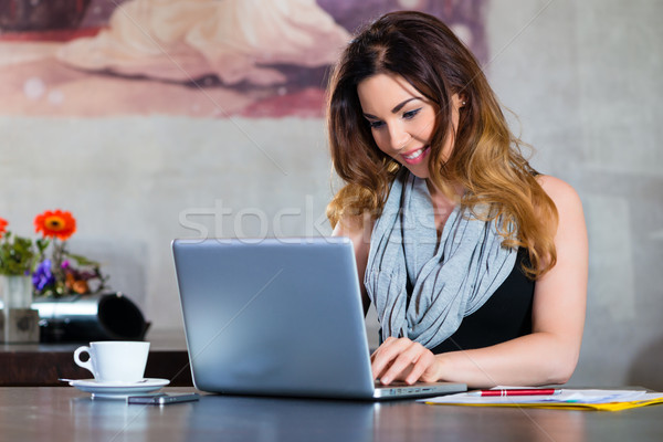 Student or businesswoman working in cafe Stock photo © Kzenon