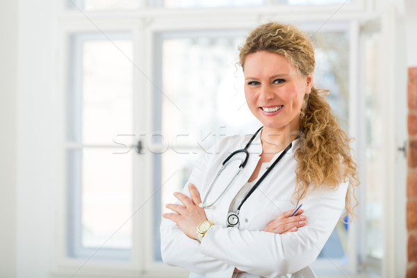 Portrait of young female doctor in clinic Stock photo © Kzenon