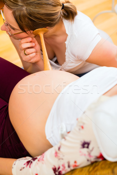Midwife seeing mother for pregnancy examination Stock photo © Kzenon