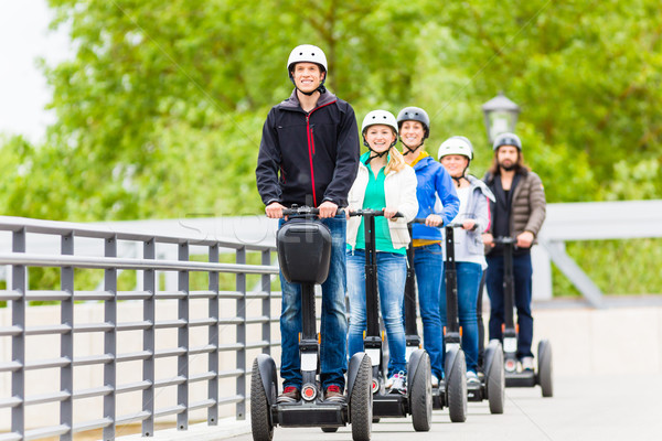 Stock photo: Tourist group driving Segway at sightseeing tour
