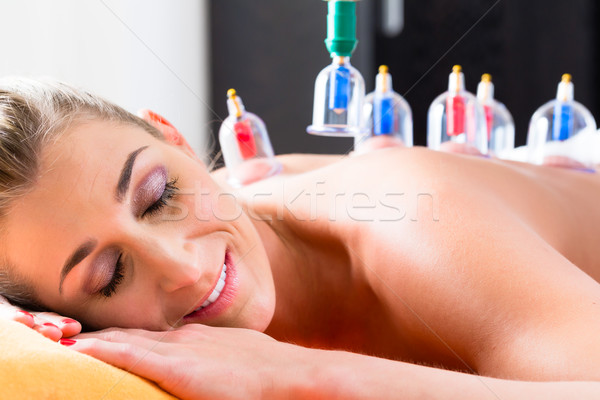 Woman in alternative medical cupping therapy Stock photo © Kzenon