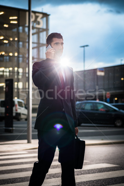 Homme d'affaires téléphone extérieur photos fort [[stock_photo]] © Kzenon
