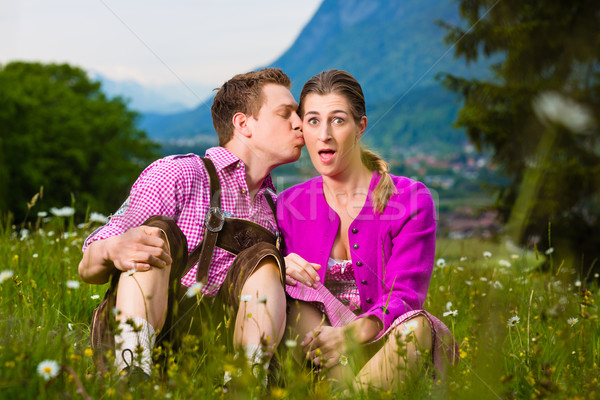 Happy couple in Alpine meadow Stock photo © Kzenon