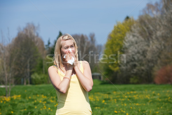 Woman with allergy sneezing Stock photo © Kzenon