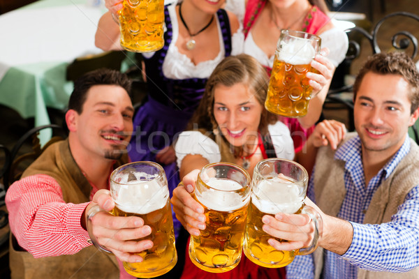 People drinking beer in Bavarian pub Stock photo © Kzenon