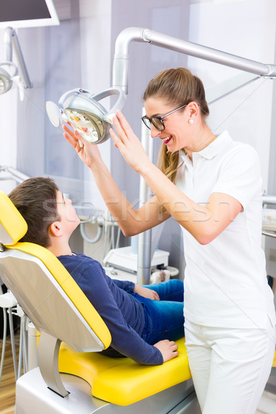 Stock photo: Dentist giving patient advice in dental surgery