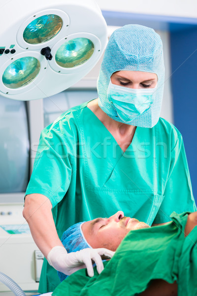 Orthopedic surgeon operating patient  Stock photo © Kzenon