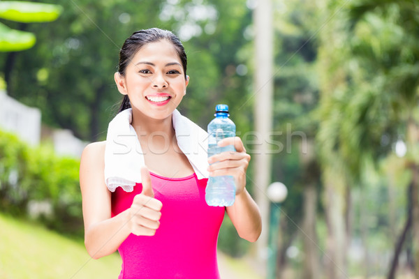Asian woman having successful sport training Stock photo © Kzenon