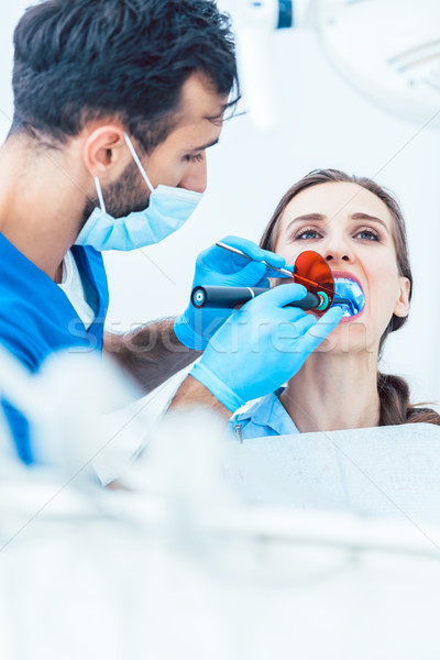 Young woman during innovative oral treatment Stock photo © Kzenon