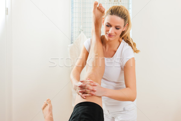 Patient at the physiotherapy doing physical therapy Stock photo © Kzenon