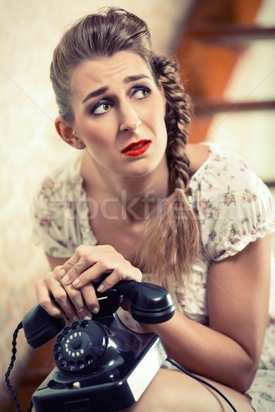 Woman sitting on the stairs and waiting for a call Stock photo © Kzenon