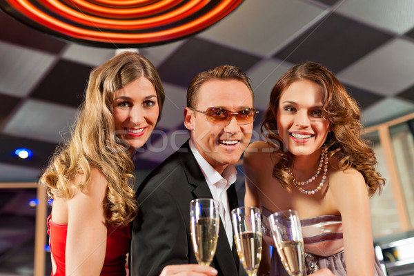 People with champagner in a bar Stock photo © Kzenon