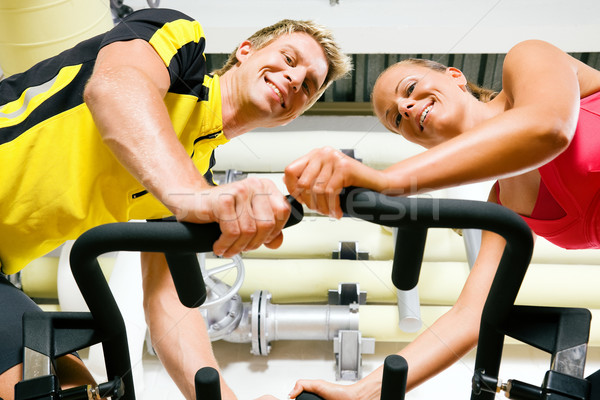 Bicycle spinning in the gym Stock photo © Kzenon