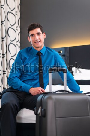 Stock photo: Man telephoning at arrival in hotel room