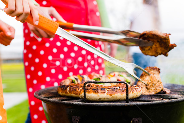 Meat and sausages on BBQ grill Stock photo © Kzenon