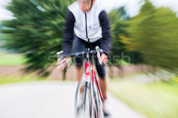 Fast Sport Bicyclist on bike with motion blur Stock photo © Kzenon