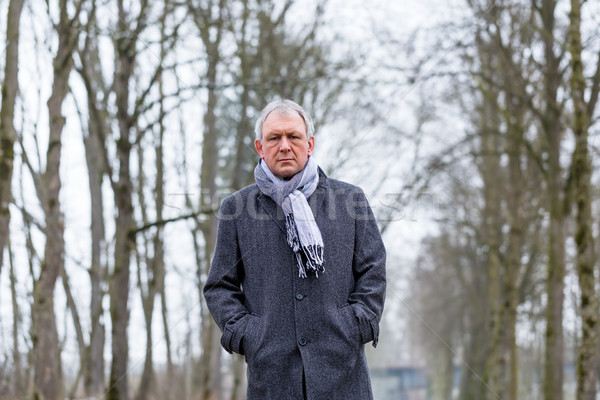 Depressed or sad man walking in winter Stock photo © Kzenon