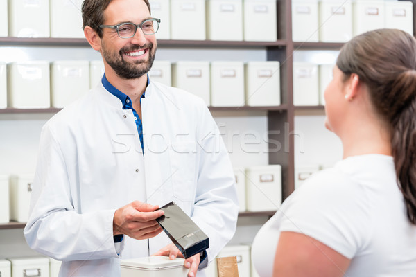 Woman shopping alternative drugs at herbalist Stock photo © Kzenon