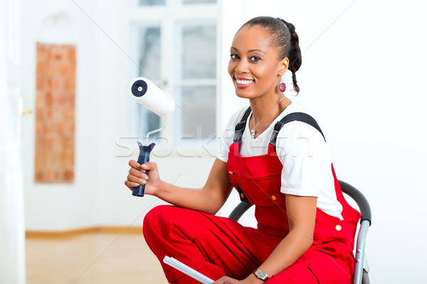 Stock photo: Woman in her home renovating diy