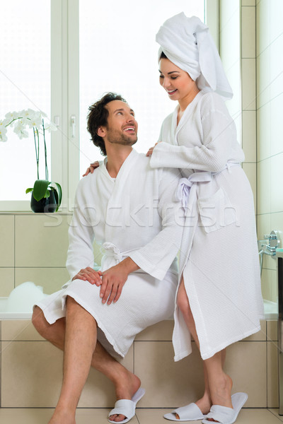 Young couple in bathrobe in hotel bathroom Stock photo © Kzenon