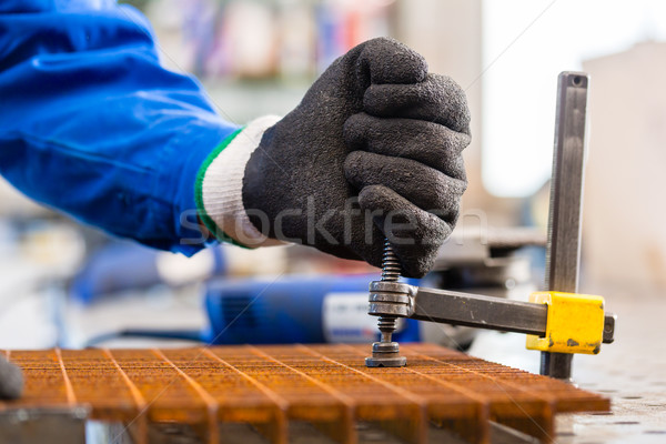 Workshop craftsman clamping metal on workbench Stock photo © Kzenon