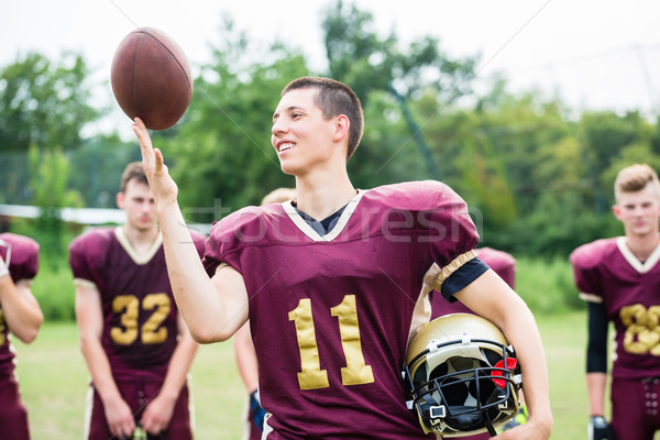 American Football player showing trick with ball Stock photo © Kzenon