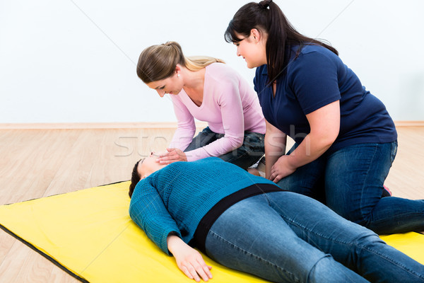 Women in first aid class training Stock photo © Kzenon