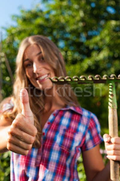 Gardening in summer - woman with grate Stock photo © Kzenon
