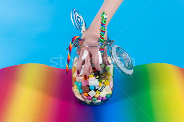 Girl with sweet goodies and candy Stock photo © Kzenon