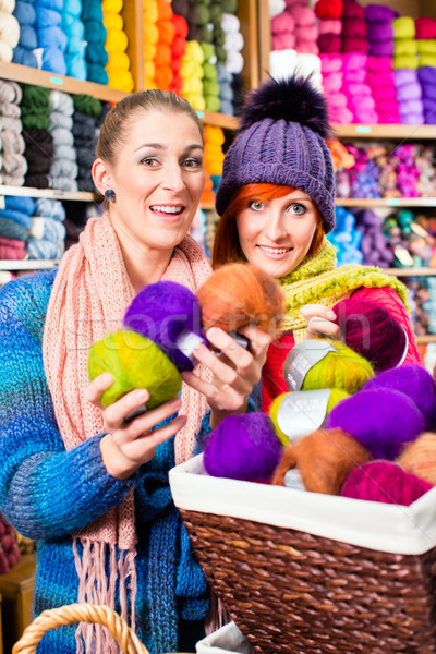 Young women in knitting shop Stock photo © Kzenon