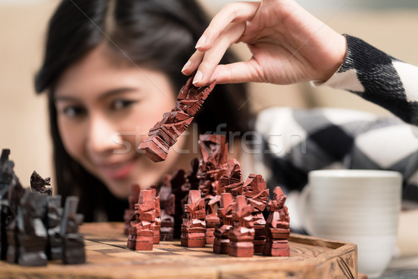 Indonésien femme jouer échecs chiffre salon [[stock_photo]] © Kzenon