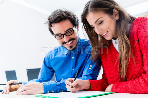 Woman and man as students working together Stock photo © Kzenon