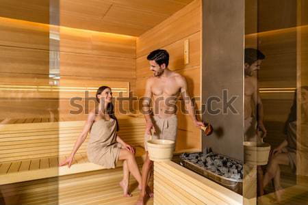 Young couple in love smiling while relaxing together in the heat Stock photo © Kzenon