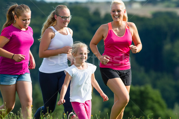 Mother and Children running for better fitness in summer Stock photo © Kzenon