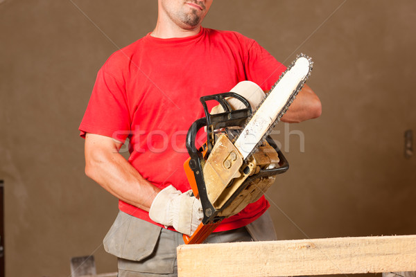 Construction worker with motor saw Stock photo © Kzenon