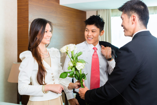 Asian Chinese hotel manager welcome VIP guests Stock photo © Kzenon