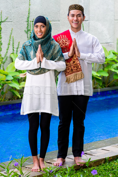 Asian Muslim couple wearing traditional dress Stock photo © Kzenon