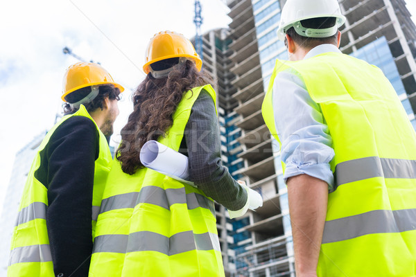 Stock photo: Construction engineers at building site of high-riser 