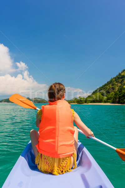 Rear view of young woman experiencing freedom during vacation in Stock photo © Kzenon