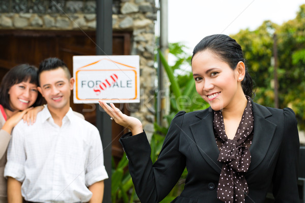 Asian couple looking for real estate Stock photo © Kzenon