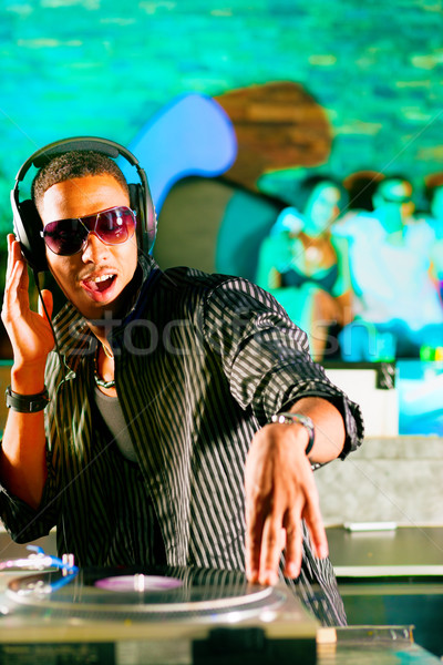 DJ in disco club, crowd background Stock photo © Kzenon