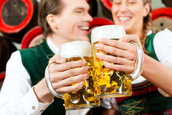 Couple drinking beer in brewery Stock photo © Kzenon