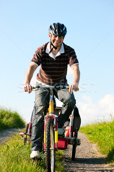 Stock photo: Family riding bicycles in summer