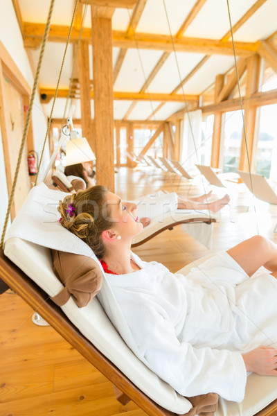 Woman relaxing on wellness spa lounger Stock photo © Kzenon