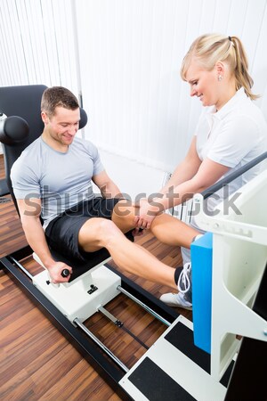 Physiotherapist or sport doctor with patient Stock photo © Kzenon