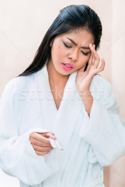 Asian Frau Aufnahme Kopfschmerzen Bademantel Haus Stock foto © Kzenon